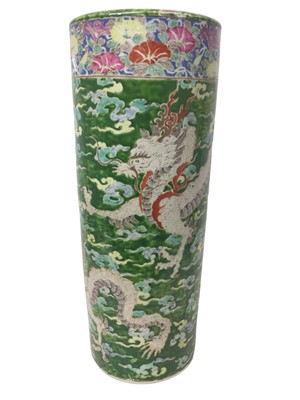 Lot 112 - Early 20th century Chinese porcelain stick stand depicting a Dragon amongst clouds, with character marks to base, 61cm in height.