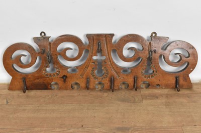 Lot 1103 - 18th/19th century French chestnut hanging rack, of pierced scrolling form, 75cm wide