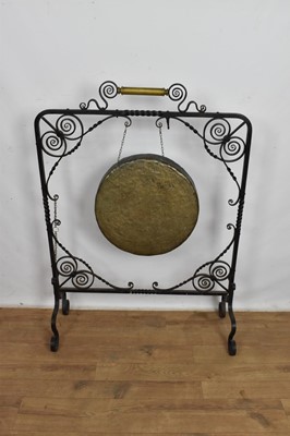 Lot 1109 - Antique dinner gong, in ornate wrought iron frame, 80cm wide