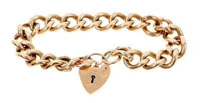 Lot 499 - Heavy 9ct gold curb link bracelet with padlock clasp