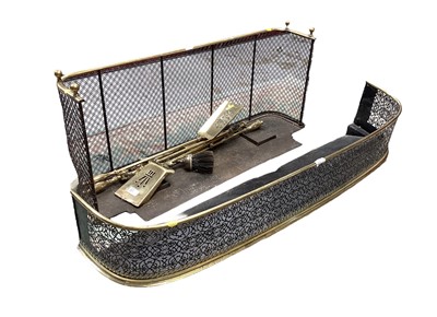 Lot 1117 - Victorian brass and mesh fire kerb, 122cm wide, together with another smaller and various fire implements