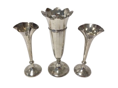 Lot 221 - Pair Edwardian spill vases with flared rims and a contemporary silver trumpet vase.