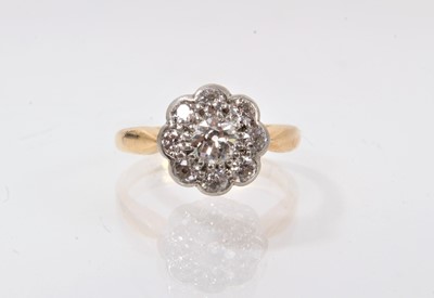 Lot 426 - Antique diamond cluster ring with a flower head cluster ring with old cut diamonds in platinum setting on 18ct gold shank