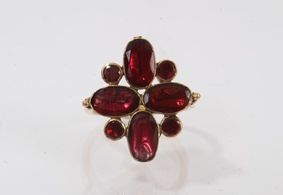 Lot 430 - George III garnet cluster with flat cut garnets in foil backed setting on later gold ring mount