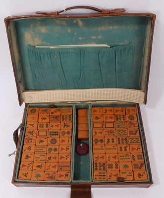 Lot 724 - Old mahjong set in brown leather case together with a set of mahjong red lacquered counter stands