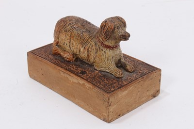 Lot 16 - A Victorian salt-glazed stoneware paperweight, surmounted by a dog, incised mark to base 'E. Le Levacher (?) 1881', 8.5cm across