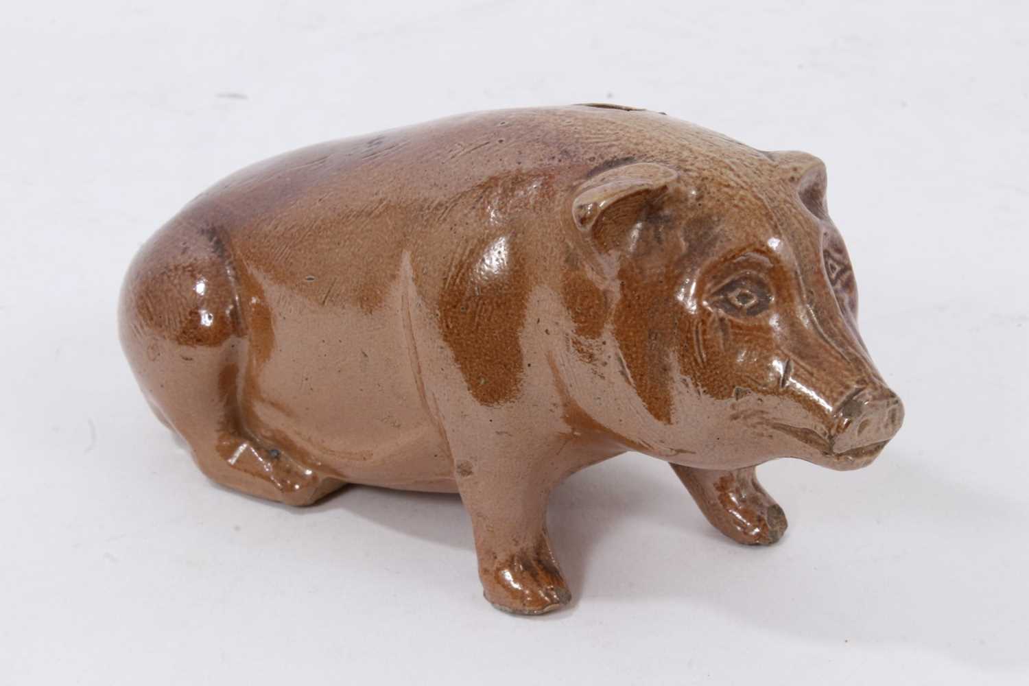 Lot 17 - A Victorian salt-glazed stoneware money box in the form of a pig, 16cm long