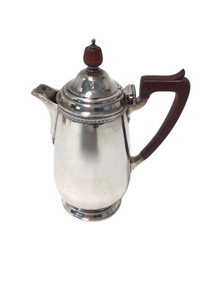 Lot 253 - 1930s silver hot water jug of baluster form with sparrow beak spout