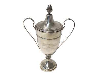 Lot 254 - 1920s silver two handled trophy cup and cover with engraved presentation inscription