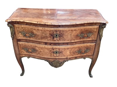 Lot 1143 - 18th century Continental king wood and feather banded commode, of serpentine form, with two long drawers over shell carved frieze on slender cabriole legs, 95cm wide x 50cm deep x 80cm high