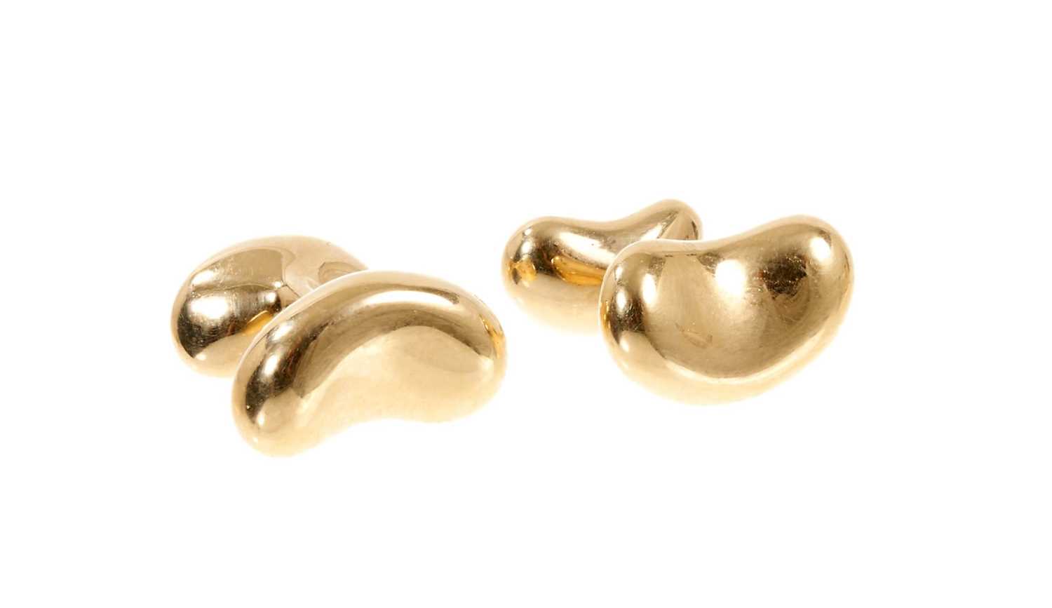 Lot 445 - Pair of 18ct gold Tiffany & Co. 'Bean' cufflinks designed by Elsa Peretti.