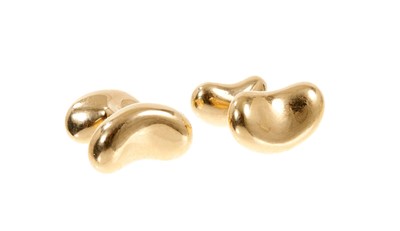 Lot 445 - Pair of 18ct gold Tiffany & Co. 'Bean' cufflinks designed by Elsa Peretti.