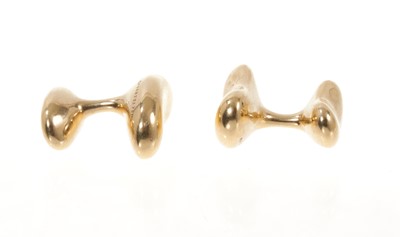 Lot 445 - Pair of 18ct gold Tiffany & Co. 'Bean' cufflinks designed by Elsa Peretti.