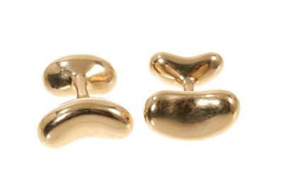 Lot 445 - Pair of 18ct gold Tiffany & Co. 'Bean' cufflinks designed by Elsa Peretti.