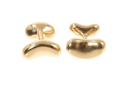 Lot 445 - Pair of 18ct gold Tiffany & Co. 'Bean' cufflinks designed by Elsa Peretti.