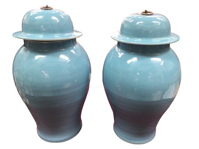 Lot 130 - Pair of Chinese light blue glazed blue jars and covers