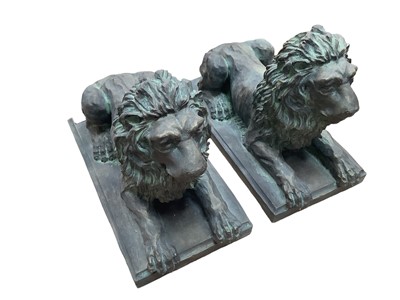 Lot 1122 - Pair of bronzed terracotta recumbent lions