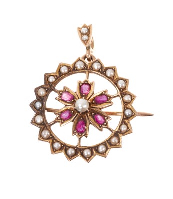 Lot 487 - Late Victorian gold ruby and seed pearl circular open work flower pendant/brooch