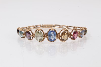 Lot 525 - Nine stone multi-gem set bracelet on 14ct gold chain