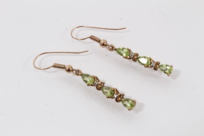 Lot 513 - Pair of peridot and diamond pendant earrings