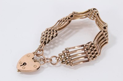 Lot 517 - Edwardian 9ct rose gold gate bracelet with padlock clasp.