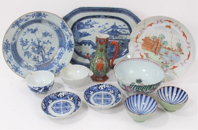 Lot 134 - Group of Chinese and Japanese porcelain, 18th century and later, including a famille rose dish with a European scene, a clobbered ewer, etc