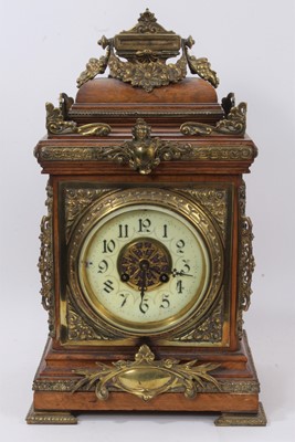 Lot 611 - Late 19th century Continental brass mounted mantel clock.