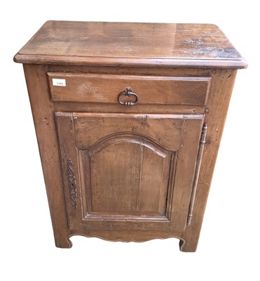 Lot 1183 - French chestnut cabinet with single drawer above an arched panelled door enclosing shelves