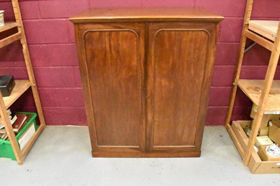 Lot 1604 - 19th century mahogany floor standing collector’s cabinet, with an arrangement of forty drawers in two banks, enclosed by pair of arched panel doors, on plinth base