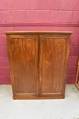 Lot 1604 - 19th century mahogany floor standing collector’s cabinet, with an arrangement of forty drawers in two banks, enclosed by pair of arched panel doors, on plinth base