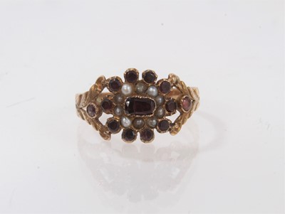 Lot 530 - Regency garnet and seed pearl ring with birfurcated shoulders on tapered shank, ring size P½.