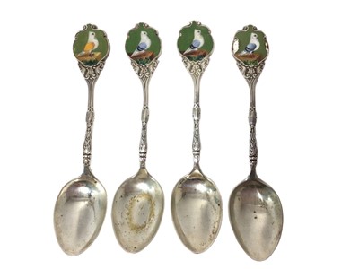 Lot 315 - Four early 20th century silver teaspoons, each with an enamel panel depicting a pigeon, (Birmingham 1911 & 1913), all at 2.7ozs