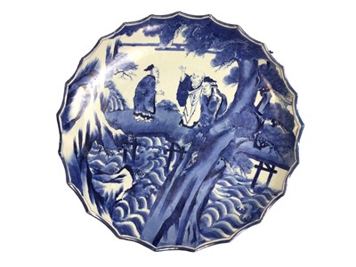 Lot 247 - Large Japanese blue and white porcelain charger, circa 1900, painted with a figural scene