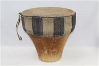 Lot 2730 - African tribal drum with animal skin covering,...