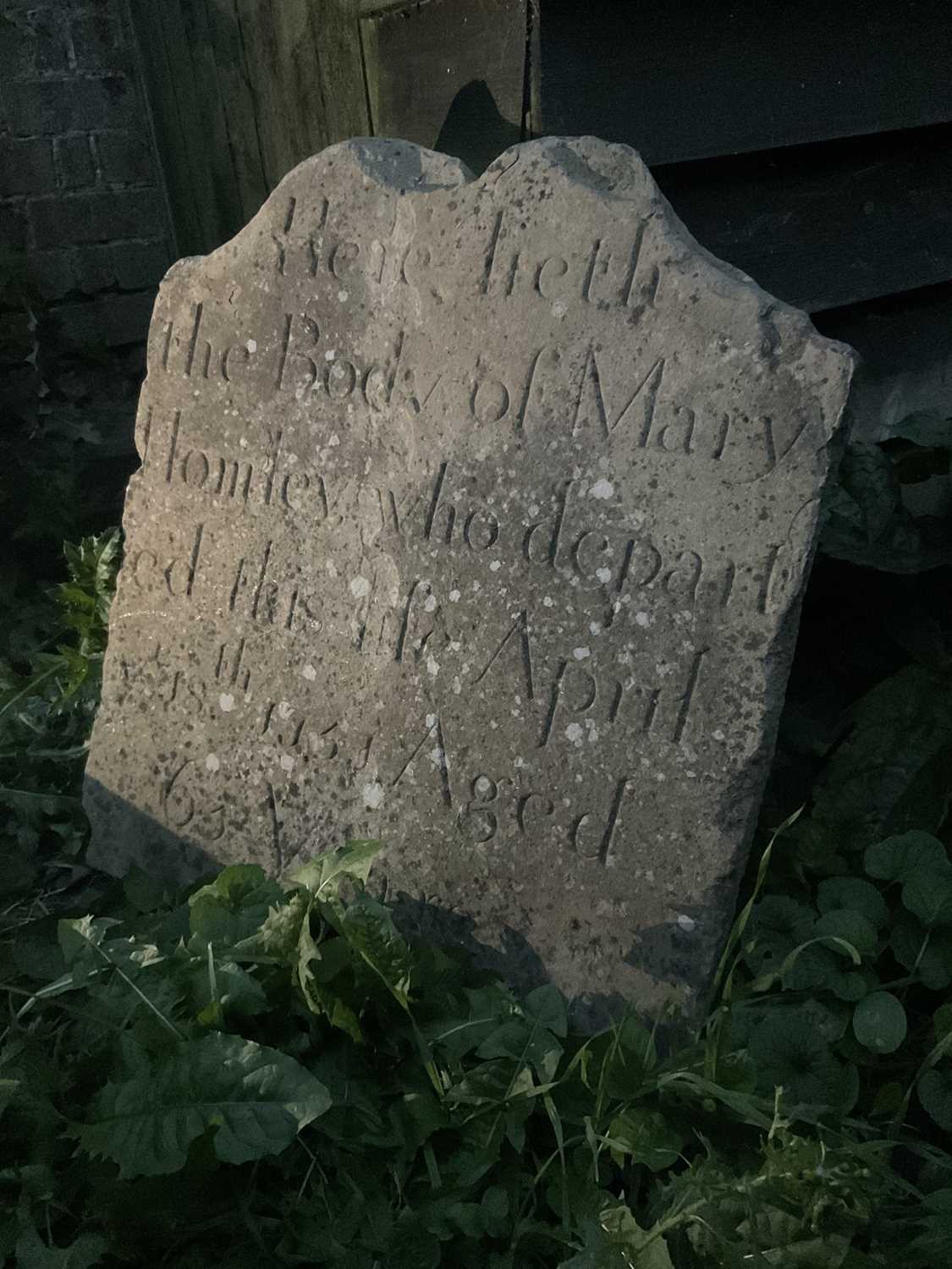 Lot 42 - Mid 18th century carved gravestone