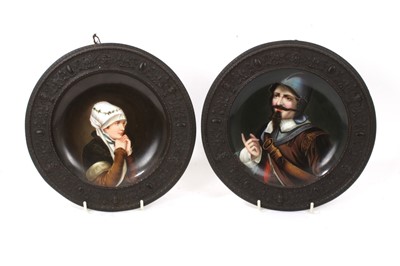 Lot 954 - Pair of 19th continental painted dishes with bronze rims