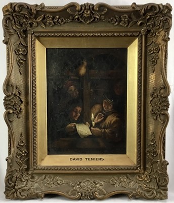 Lot 134 - Manner of David Teniers, oil on board, 19th century of figures seated round a table lit 
by candle light, in gilt frame, 22 x 17cm