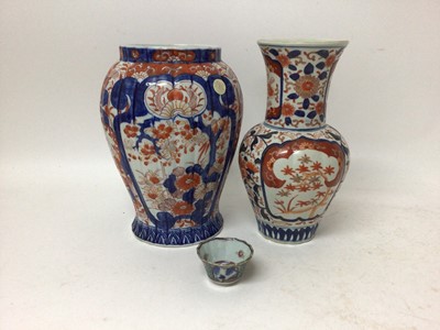 Lot 18 - Two Japanese Imari vases and an 18th century Chinese clobbered porcelain tea bowl (3)