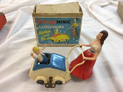 Lot 184 - Triang Minic clockwork Fire Engine (box poor) & clockwork Mother and Pram, boxed (2)