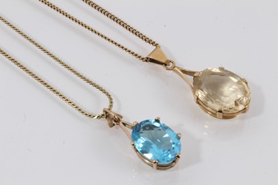 Lot 754 - Blue topaz single stone pendant together with a citrine single stone pendant