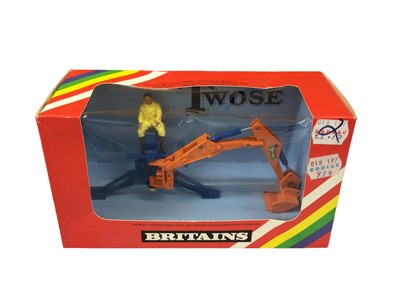 Lot 215 - Britains Autoway No. 9832 post hole digger, No. 9830 mini trailer, No. 9536 rear mountain digger (x2) plus 9670 dump truck, all boxed (5)