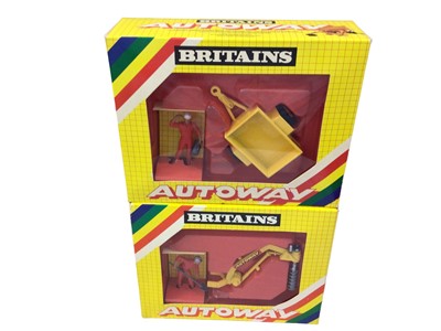 Lot 215 - Britains Autoway No. 9832 post hole digger, No. 9830 mini trailer, No. 9536 rear mountain digger (x2) plus 9670 dump truck, all boxed (5)
