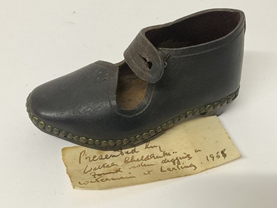 Lot 63 - Mysterious leather child's clog with note of provenance ''Presented by Walter Sheldrake, found when digging a water main at Ealing 1955''