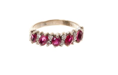 Lot 820 - Ruby and diamond ring with a half hoop of marquise cut rubies and brilliant cut diamonds in 18ct white gold setting