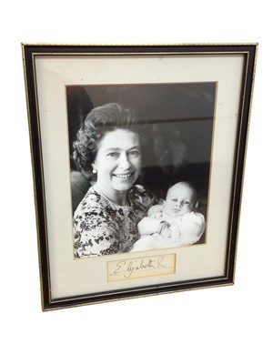 Lot 115 - H.M. Queen Elizabeth II charming photograph with her first grandson Peter Phillips with signature in frame