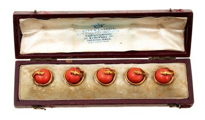 Lot 762 - Set of five Victorian gold and coral 'snake' dress studs in original fitted leather box by Hunt & Roskell