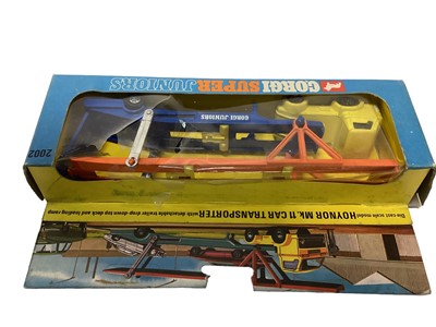 Lot 289 - Corgi Juniors police station set No. 3052 transporter No. 3105, James Bond Spy Who Loved Me gift set No. 3030, E2007 low loader and shovel, No. 2002 Haynor Mk11 car transporter, all boxed (5)