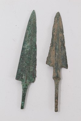 Lot 1073 - Two large Bronze Age arrow heads