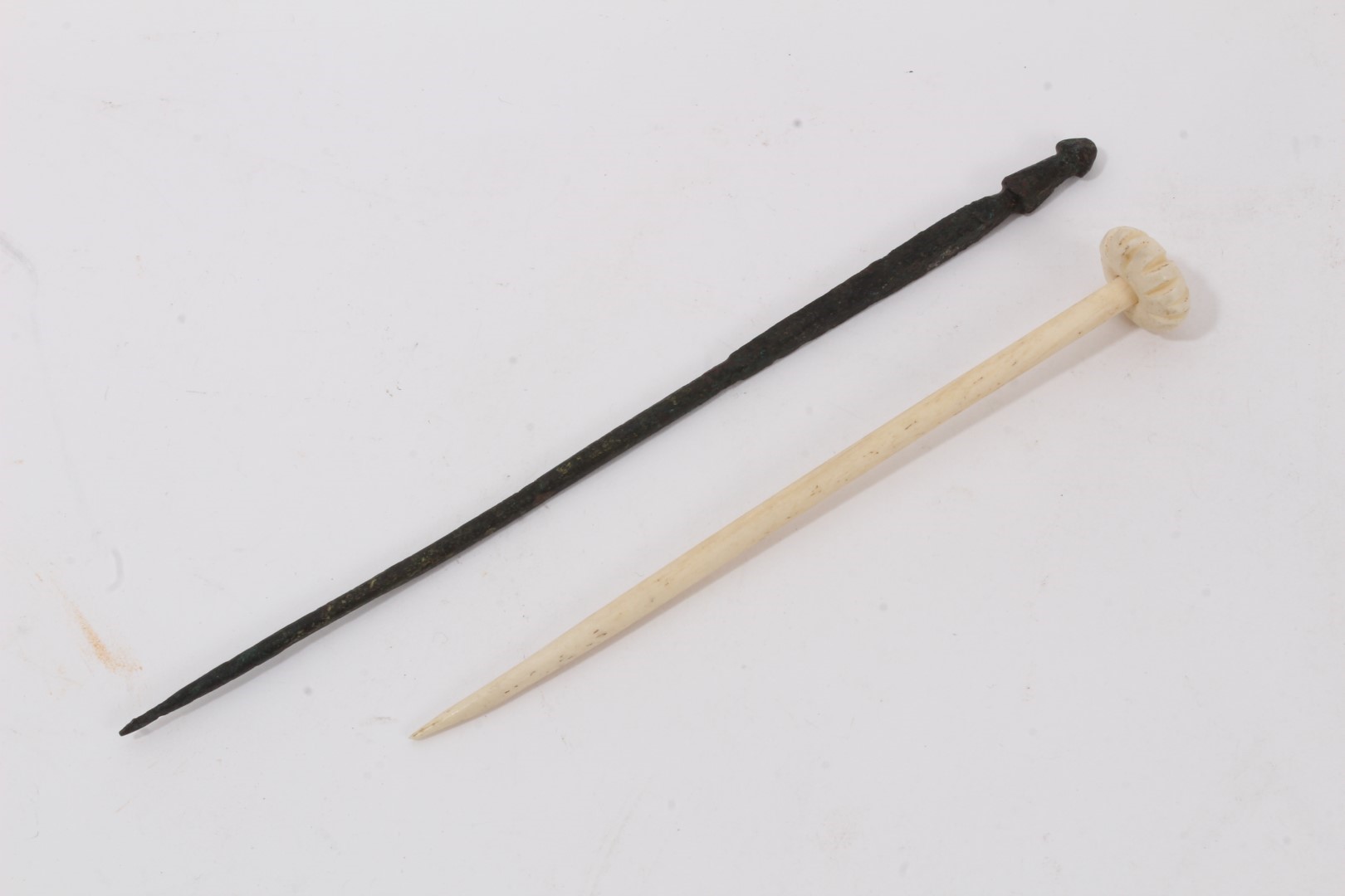 Lot 1072 - Bronze Roman pin and a Roman carved bone