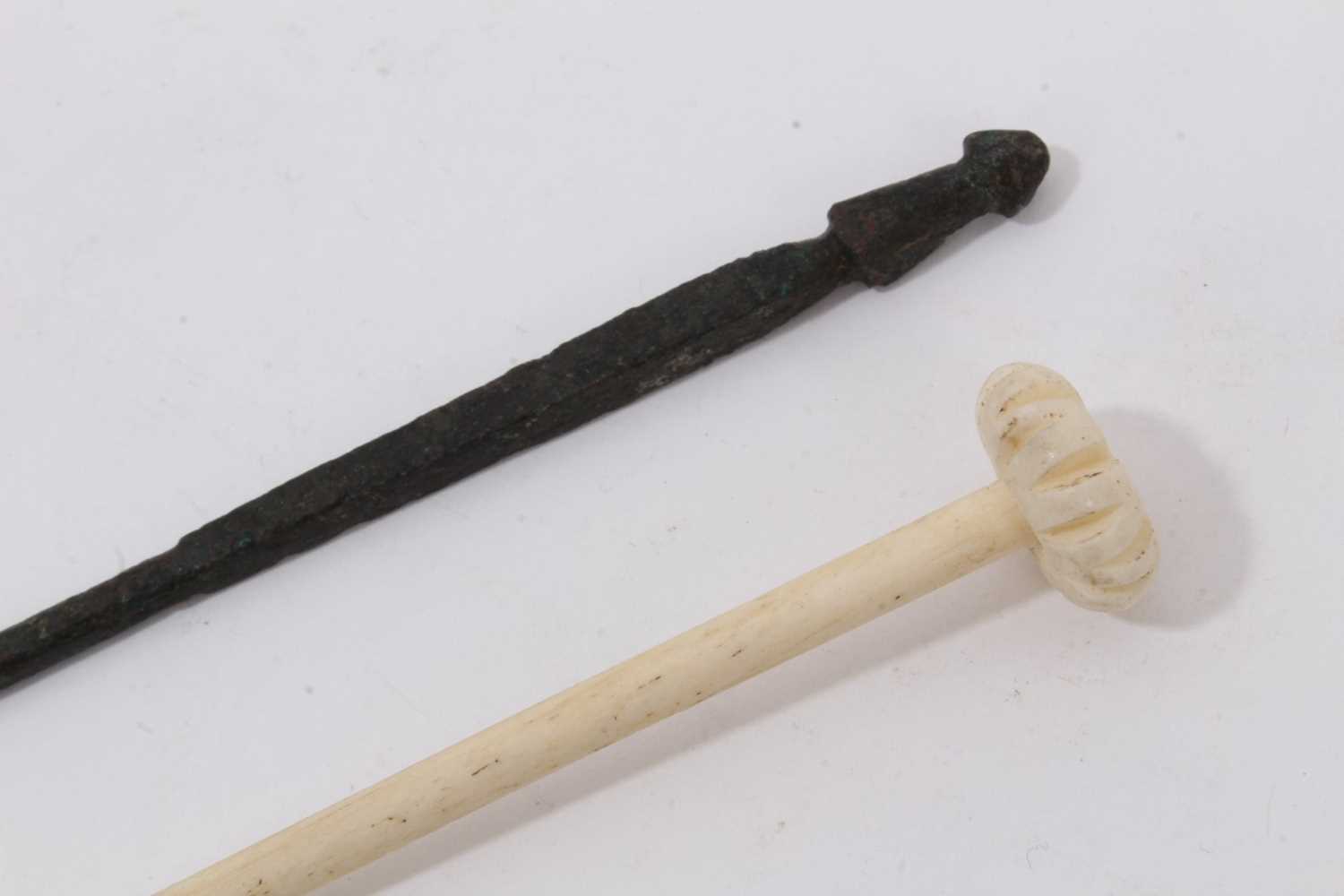 Lot 1072 - Bronze Roman pin and a Roman carved bone